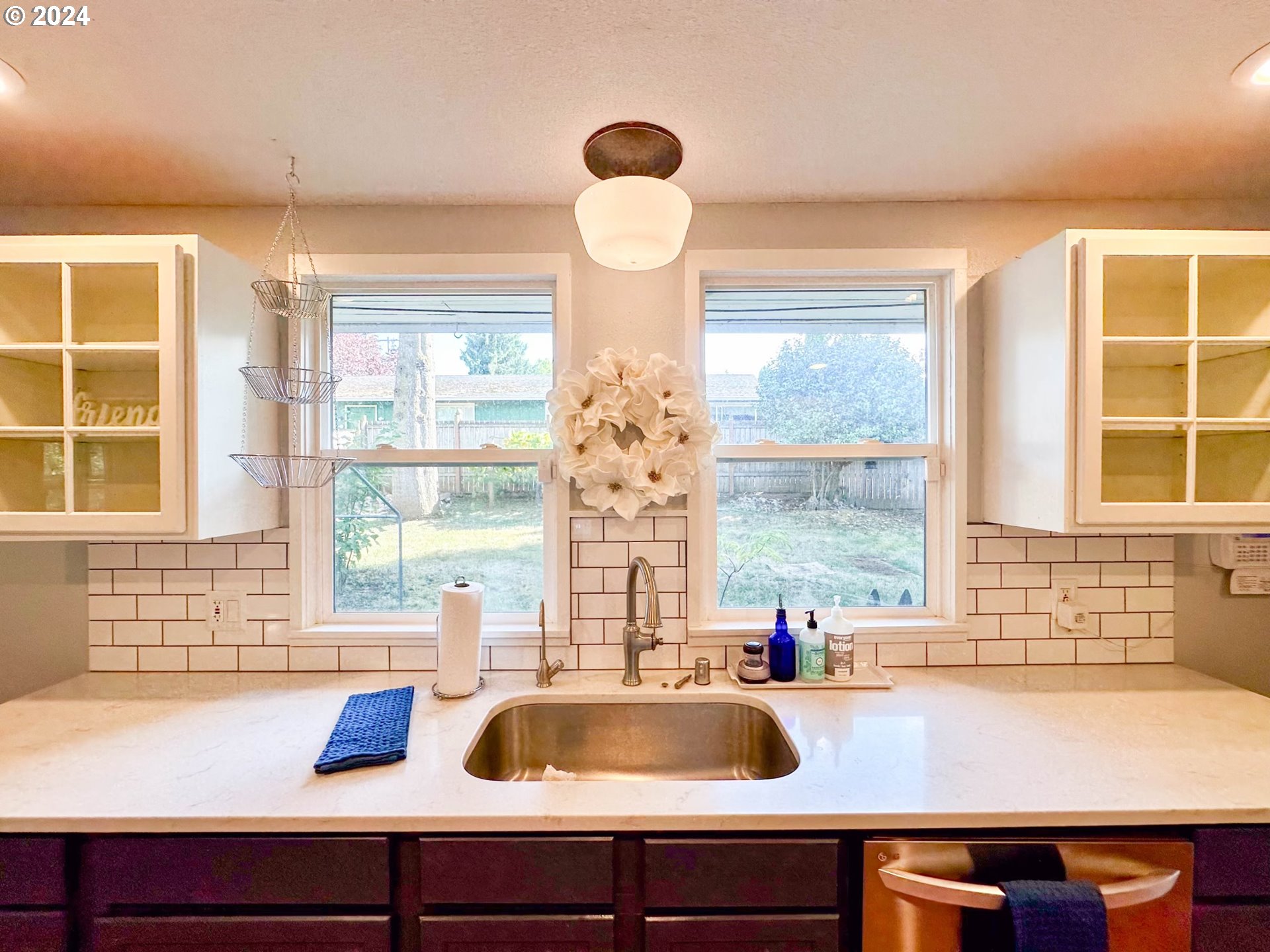 3010 R Street Vancouver, WA 98663 - Photo 14 of 43 a kitchen with a sink and a large window