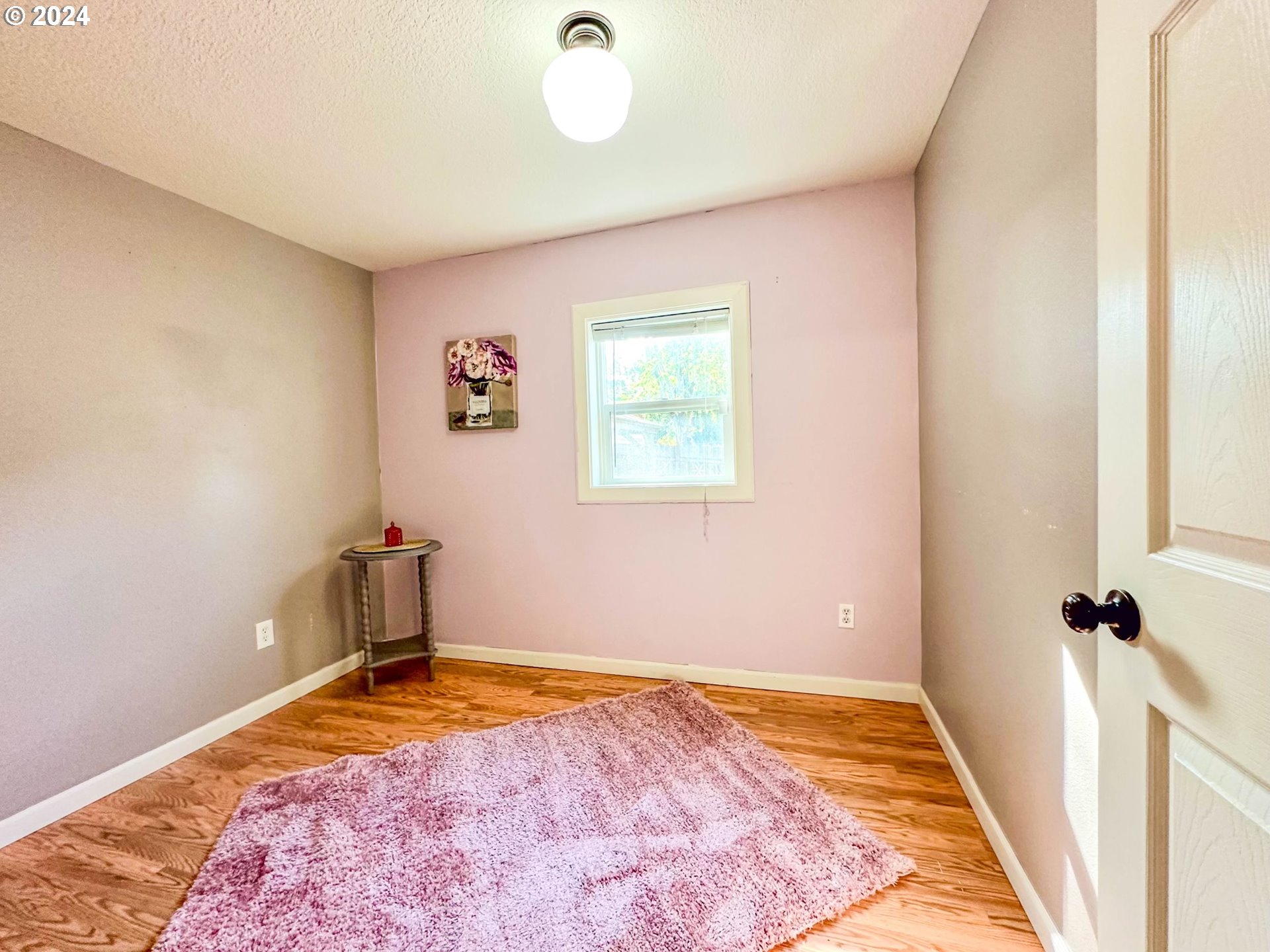 3010 R Street Vancouver, WA 98663 - Photo 28 of 43 a view of a livingroom with wooden floor and a window