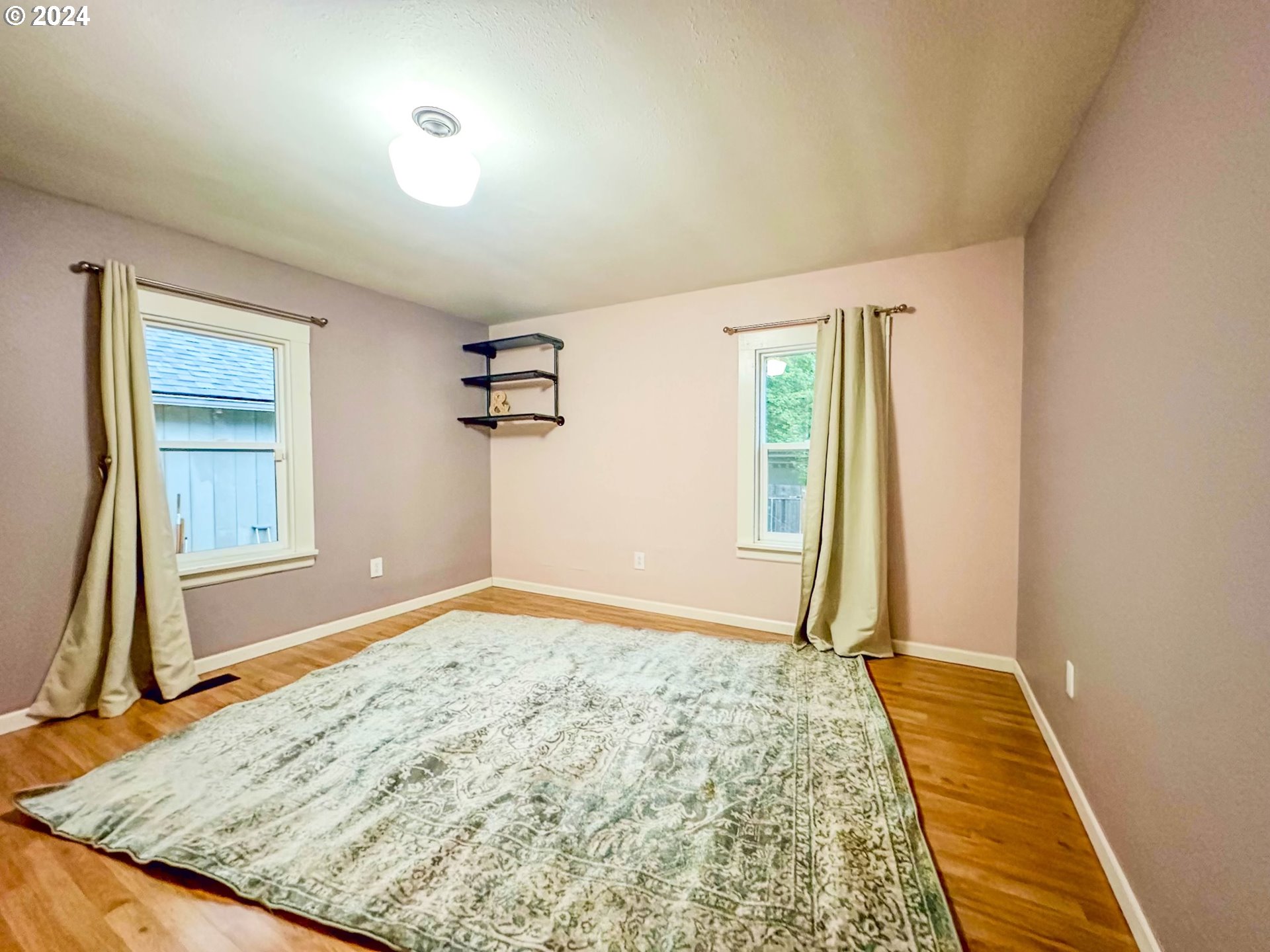 3010 R Street Vancouver, WA 98663 - Photo 29 of 43 a view of empty room with wooden floor and window