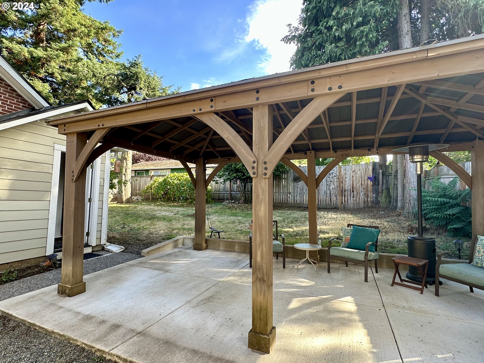 3010 R Street Vancouver, WA 98663 - Photo 35 of 43 a view of porch with a table and chairs under an umbrella