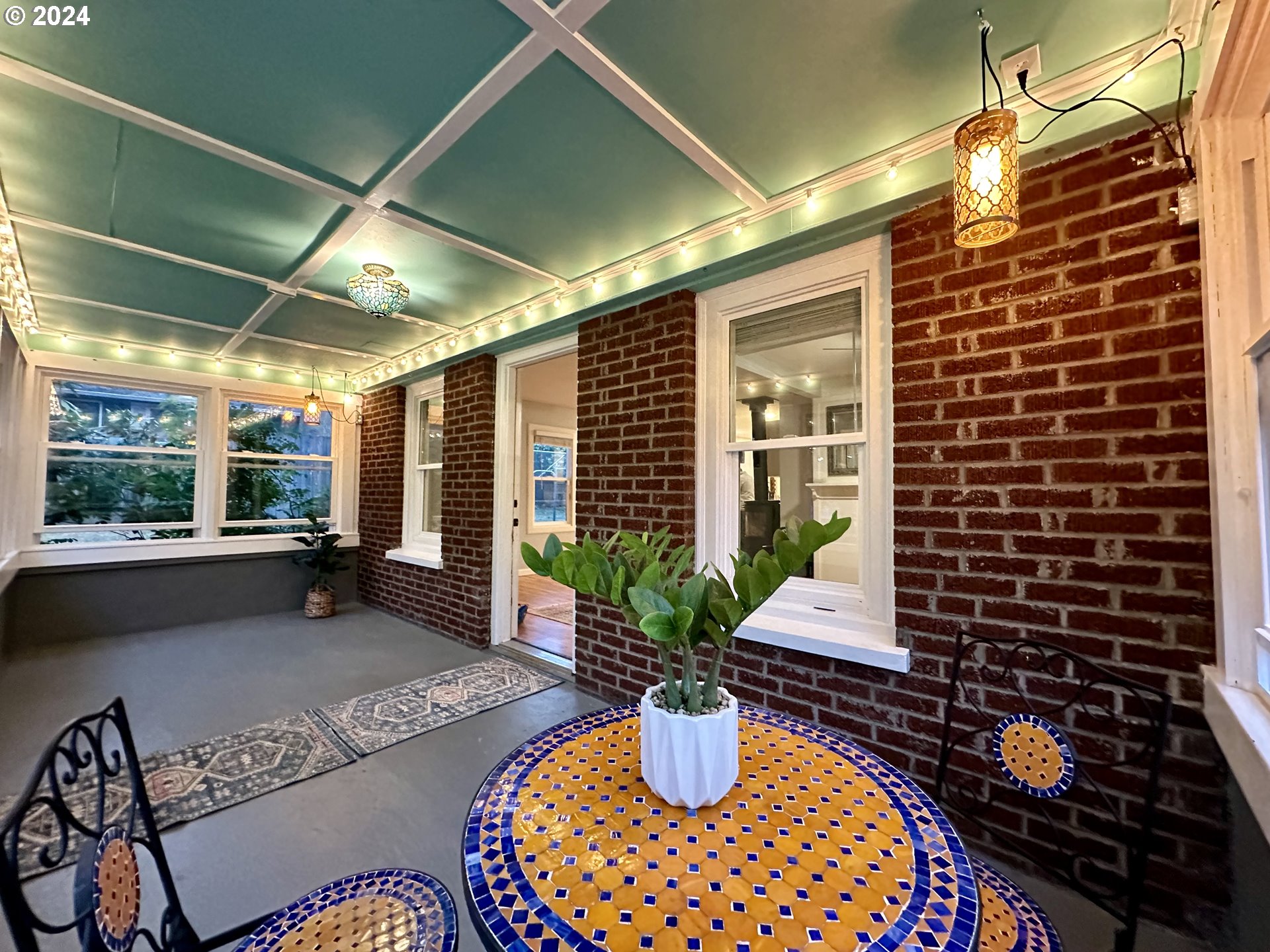 3010 R Street Vancouver, WA 98663 - Photo 4 of 43 a view of a porch with dining table and chairs