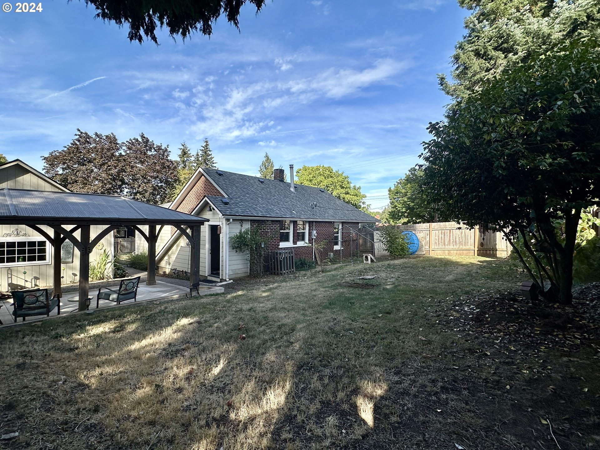 3010 R Street Vancouver, WA 98663 - Photo 42 of 43 a view of a house with yard and a tree