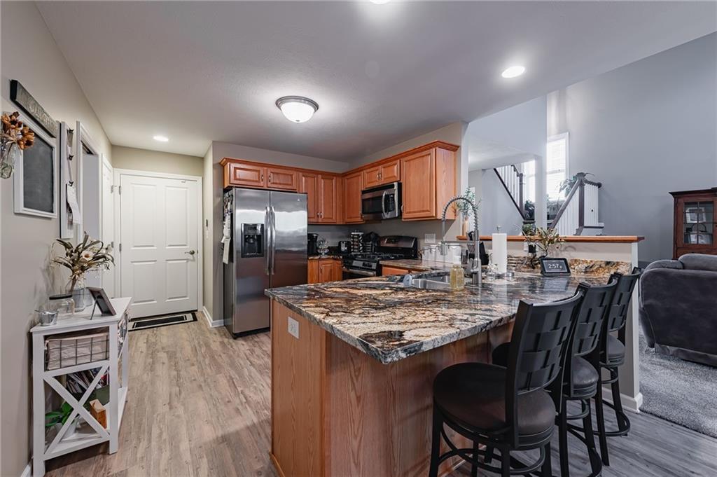 424 Chestnut Lane Apollo, PA 15613 - Photo 14 of 33 a kitchen with a table chairs refrigerator and microwave