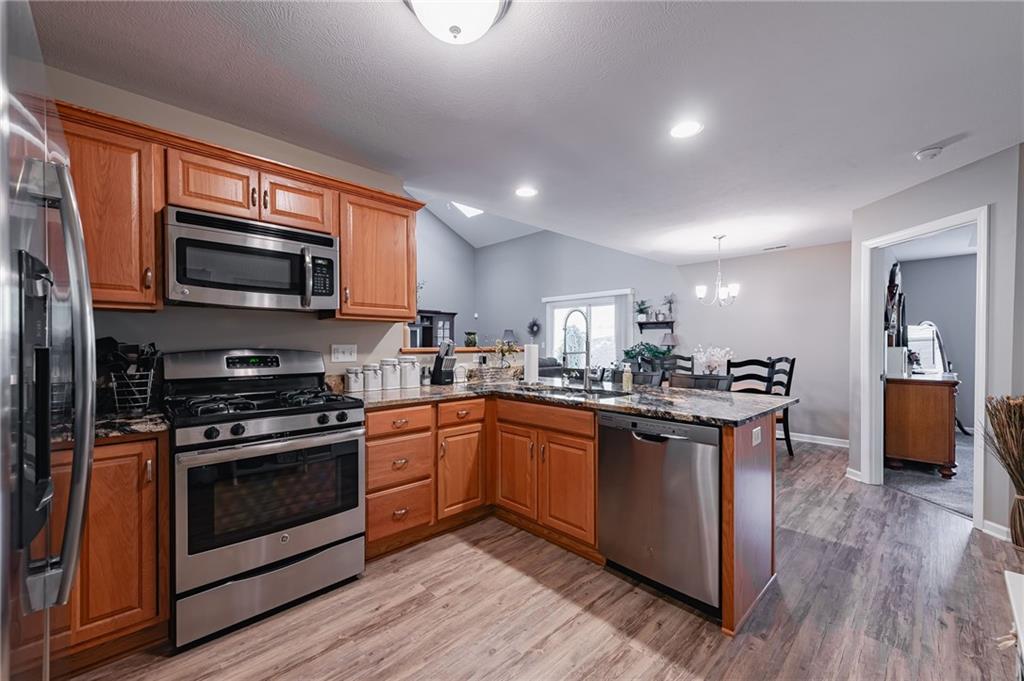424 Chestnut Lane Apollo, PA 15613 - Photo 15 of 33 a kitchen with stainless steel appliances granite countertop wooden floors and view