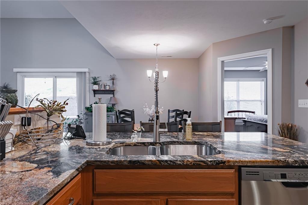 424 Chestnut Lane Apollo, PA 15613 - Photo 16 of 33 a kitchen with granite countertop a sink and a wooden floor