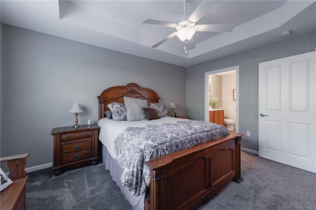 424 Chestnut Lane Apollo, PA 15613 - Photo 19 of 33 a bedroom with a bed and a chandelier