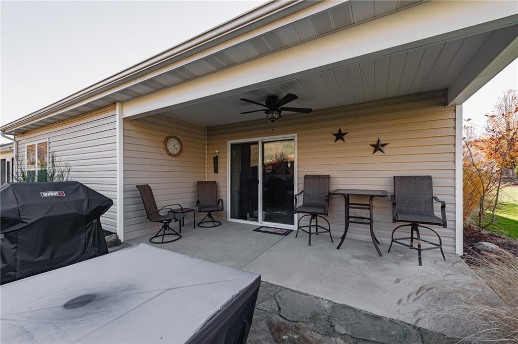 424 Chestnut Lane Apollo, PA 15613 - Photo 25 of 33 a view of a patio with table and chairs with wooden floor and fence
