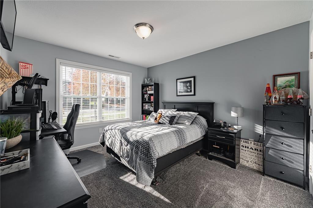 424 Chestnut Lane Apollo, PA 15613 - Photo 6 of 33 a bedroom with a bed a couch and dresser