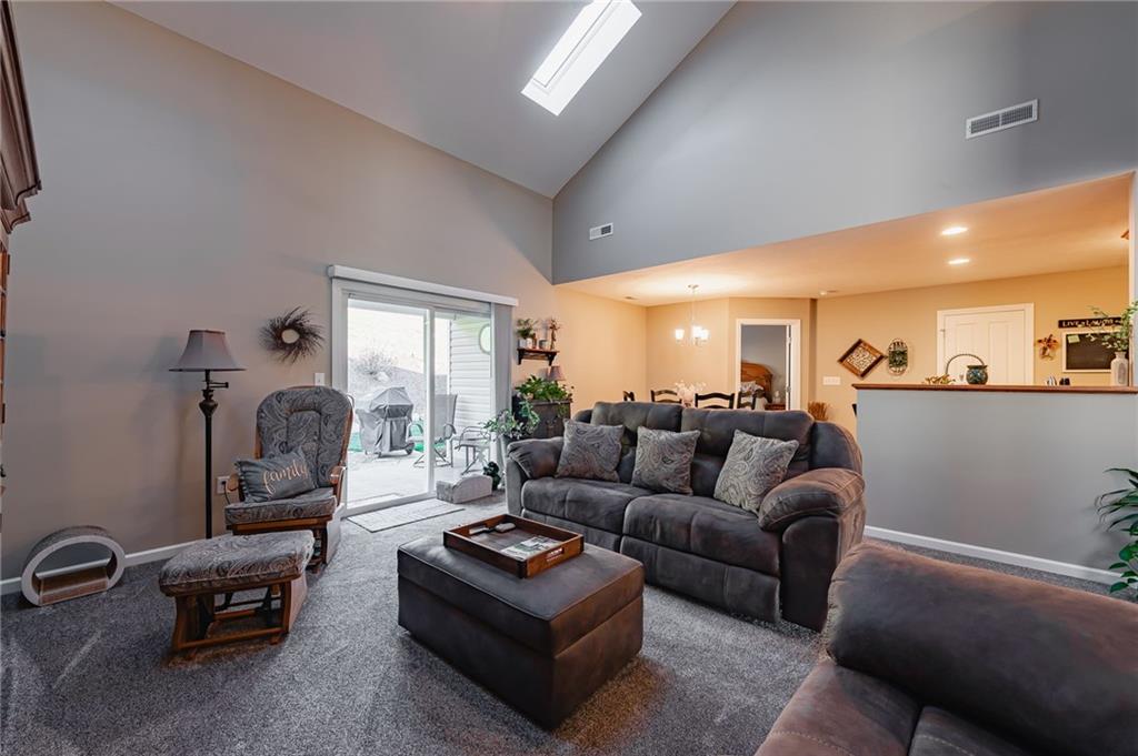 424 Chestnut Lane Apollo, PA 15613 - Photo 9 of 33 a living room with furniture a rug and a chandelier