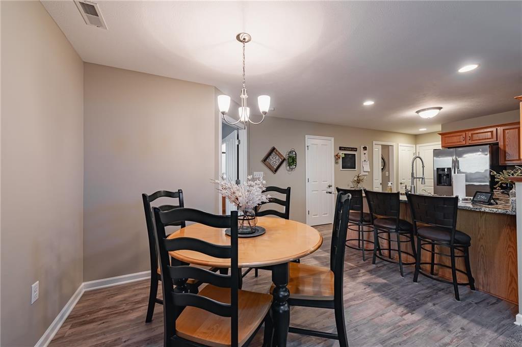 424 Chestnut Lane Apollo, PA 15613 - Photo 10 of 33 a view of a dining room with furniture and wooden floor