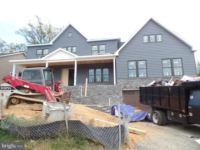 a view of house with outdoor seating