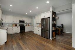 146 Hackney Trail Ellijay, GA 30536 - Photo 13 of 26 a kitchen with a refrigerator a stove top oven and kitchen island