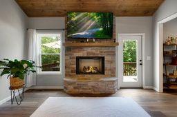 146 Hackney Trail Ellijay, GA 30536 - Photo 14 of 26 a living room with furniture and a fireplace