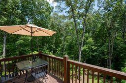 146 Hackney Trail Ellijay, GA 30536 - Photo 16 of 26 a balcony with table and chairs