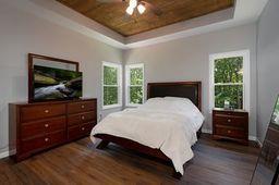 146 Hackney Trail Ellijay, GA 30536 - Photo 18 of 26 a bedroom with a bed and a flat screen tv