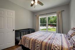 146 Hackney Trail Ellijay, GA 30536 - Photo 21 of 26 a bed sitting in a bedroom next to a window