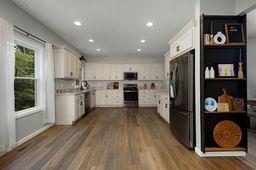 146 Hackney Trail Ellijay, GA 30536 - Photo 10 of 26 a kitchen with stainless steel appliances granite countertop a refrigerator and a stove