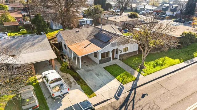 a aerial view of a house with swimming pool and porch