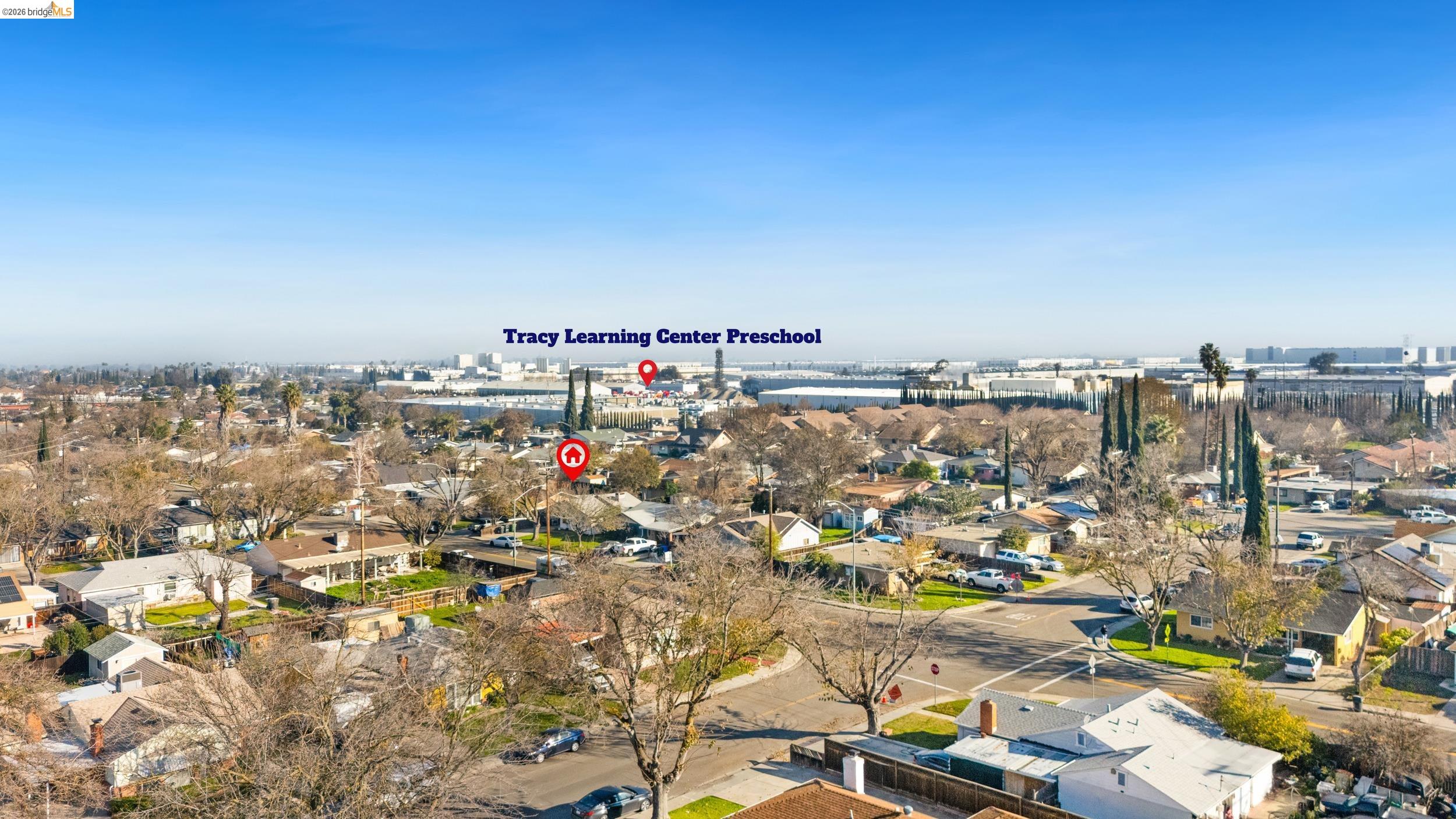 1704 East Street Tracy, CA 95376 - Photo 28 of 29 Aerial view of property's location featuring nearby suburban area and a large body of water
