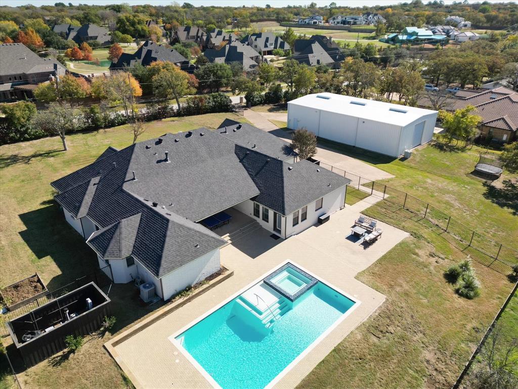 13297 Roanoke Road Westlake, TX 76262 - Photo 1 of 1 an aerial view of a house with a swimming pool and mountains