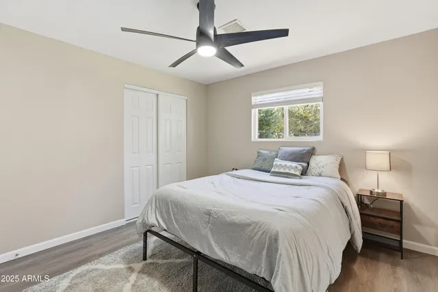 a bedroom with a bed and a window