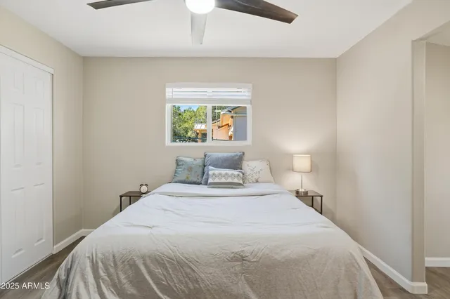 a bedroom with a bed and a window