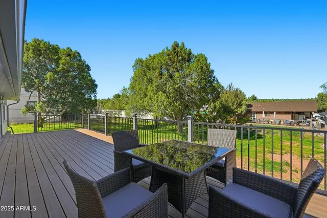 a view of a chairs with a table and chairs on the roof deck