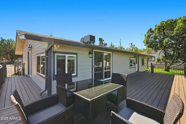 a view of house with a chairs in patio