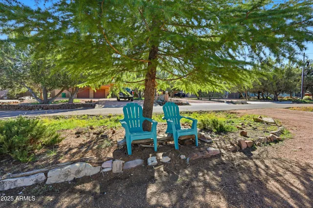 a view of yard with green space and seating area