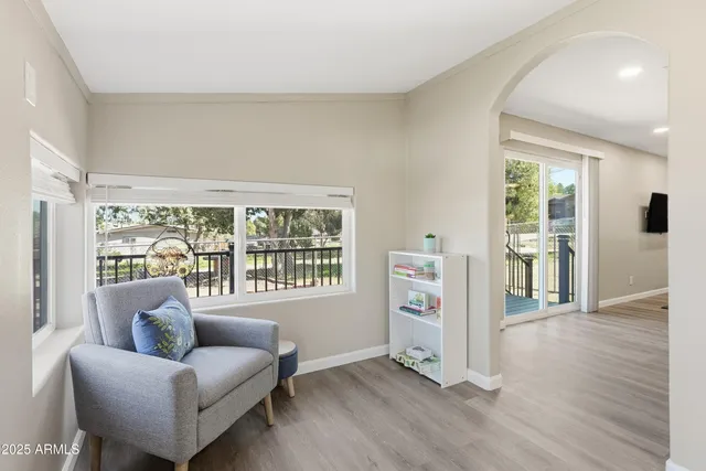 a living room with furniture and a large window