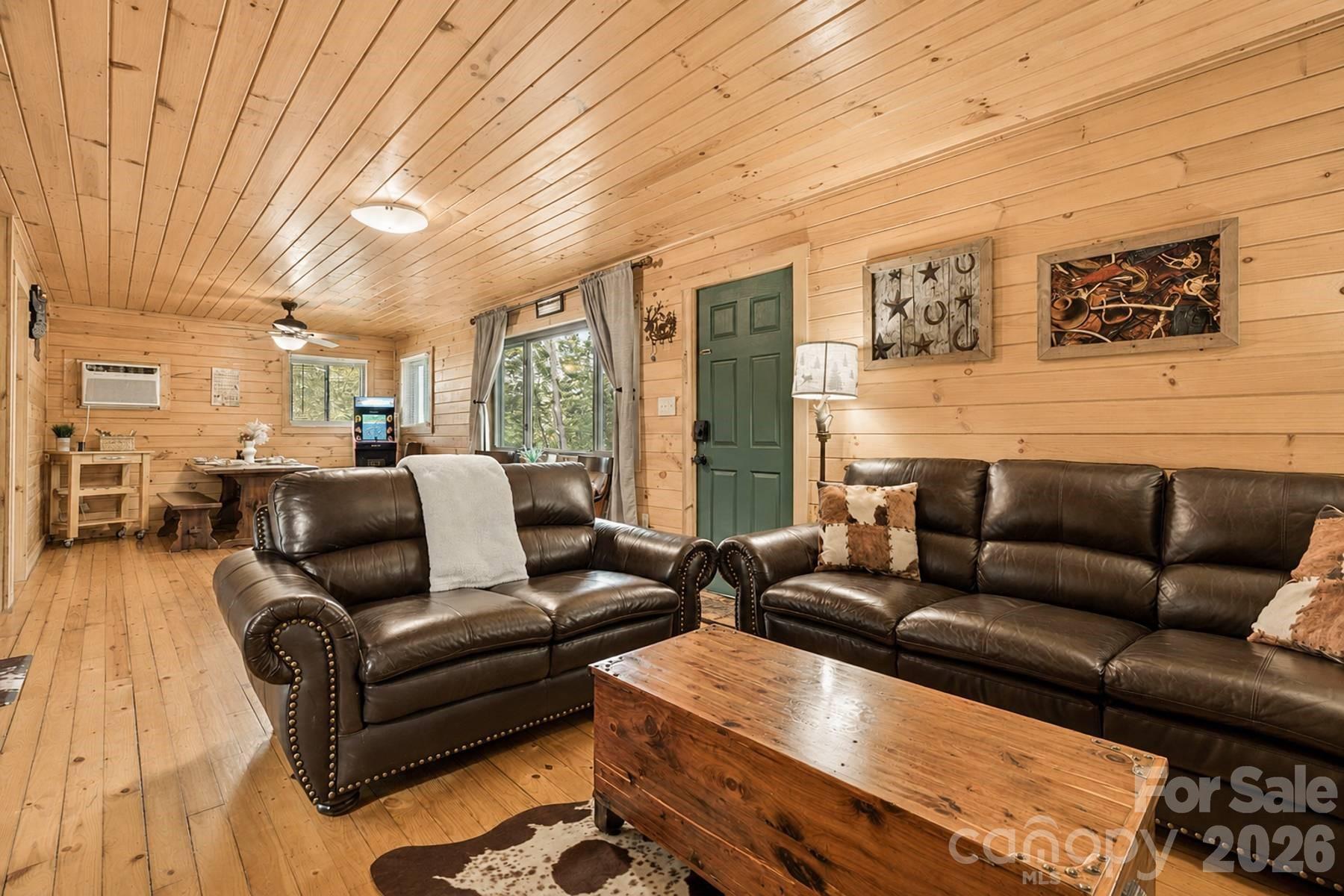 319 Blue Ridge Parkway, Unit 53 Bryson City, NC 28713 - Photo 4 of 22 a living room with furniture and a large window