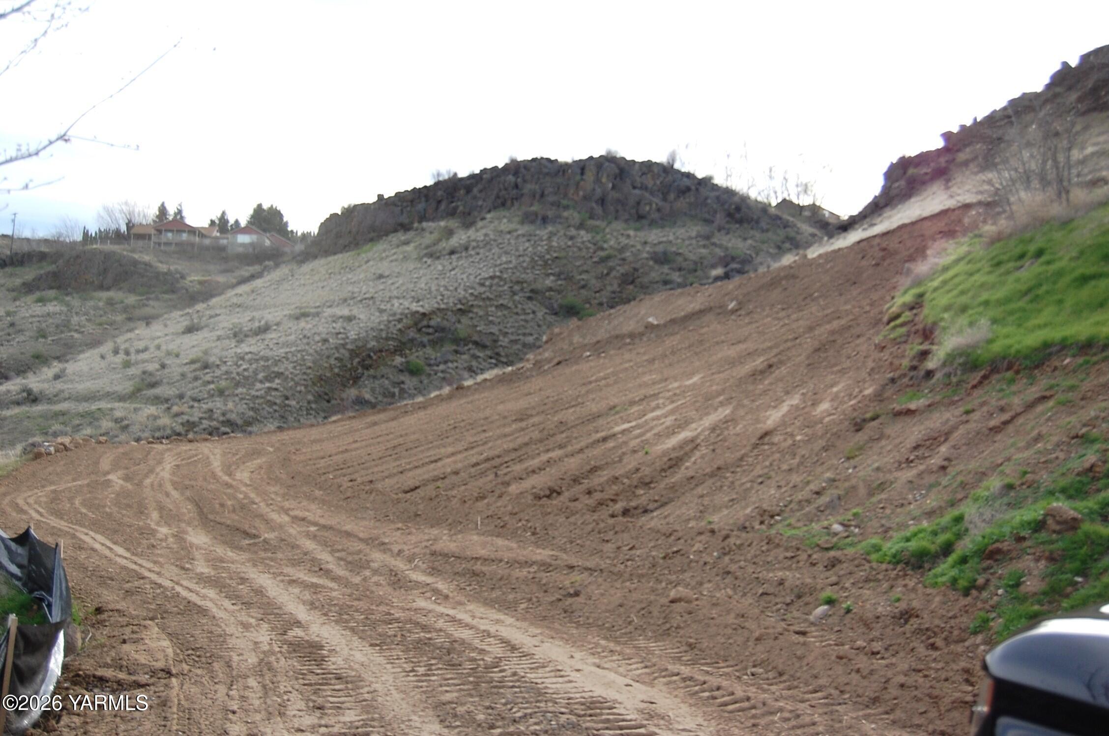 Nka Nka Naches Road South Yakima, WA 98908 - Photo 5 of 11 a view of a dry yard with mountains in the background