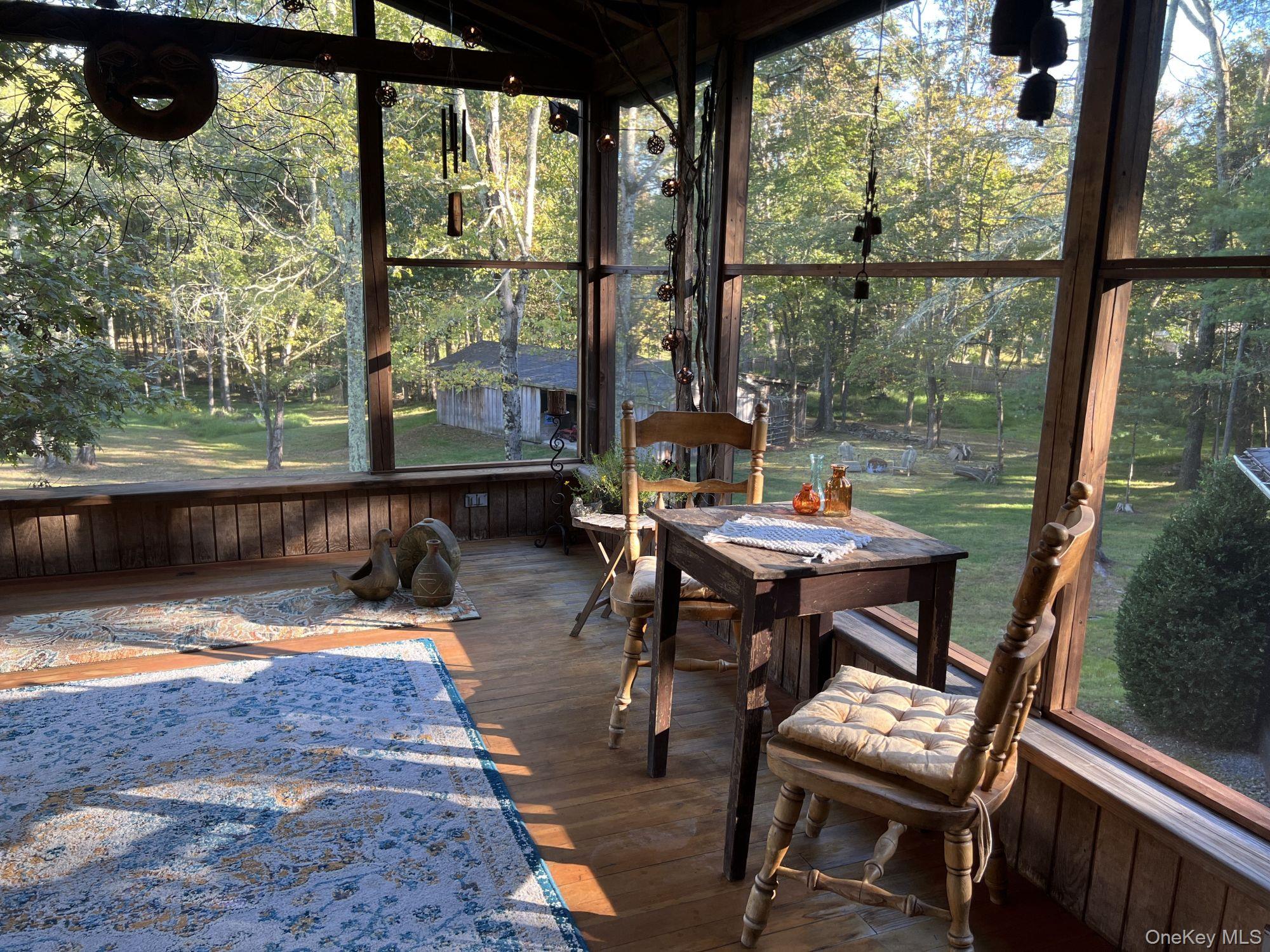 404 John Joy Road Saugerties, NY 12477 - Photo 13 of 50 a view of a porch with chairs and backyard