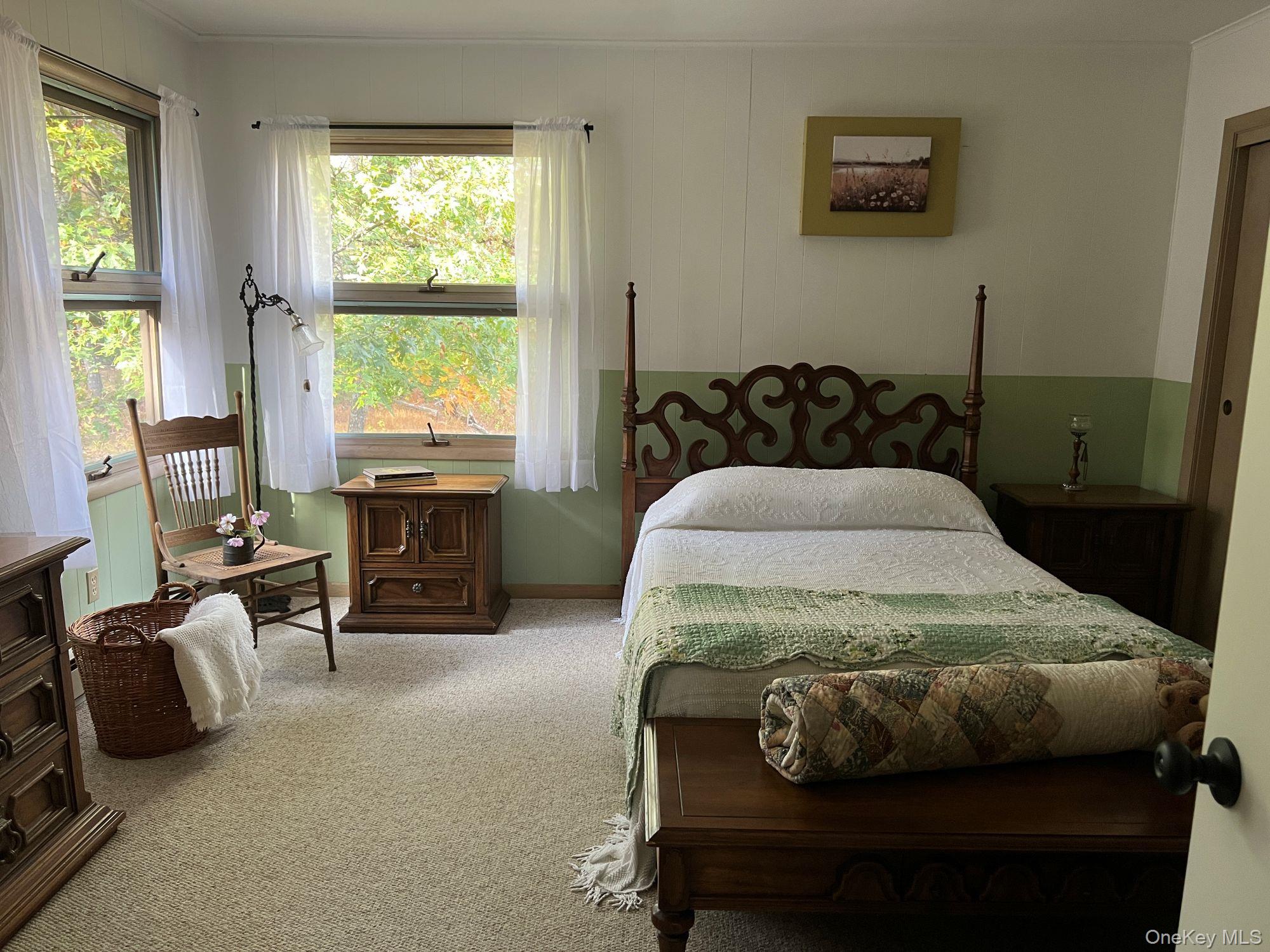 404 John Joy Road Saugerties, NY 12477 - Photo 14 of 50 a bedroom with a bed and a table