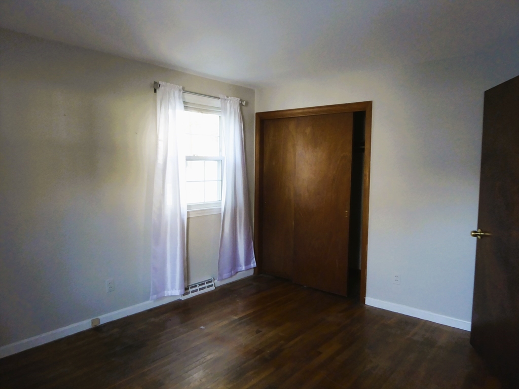 12 Gordon Drive Holyoke, MA 01040 - Photo 15 of 33 an empty room with wooden floor and windows