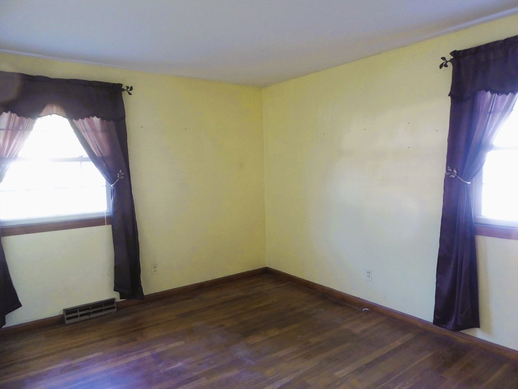 12 Gordon Drive Holyoke, MA 01040 - Photo 20 of 33 a view of empty room with wooden floor and fan
