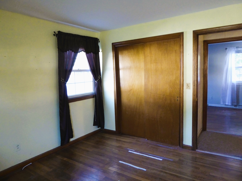 12 Gordon Drive Holyoke, MA 01040 - Photo 23 of 33 an empty room with wooden floor and closet