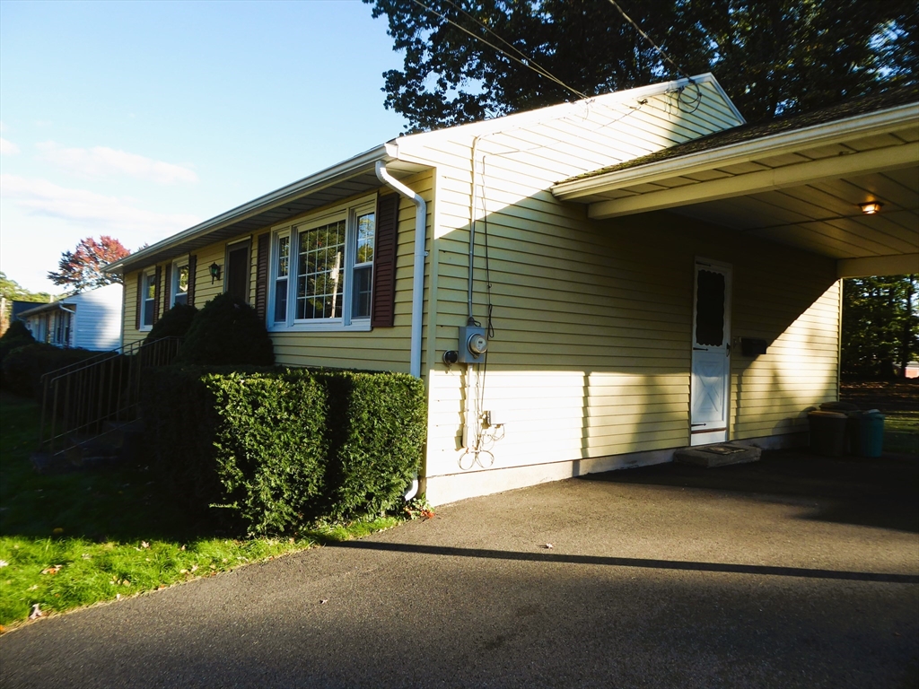 12 Gordon Drive Holyoke, MA 01040 - Photo 32 of 33 a front view of a house with a yard and garage