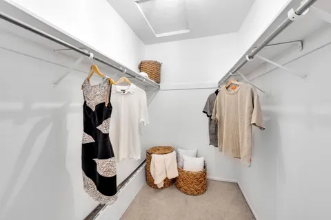 a bedroom with bed and a night stand