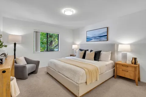 a bedroom with bed and window