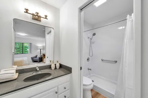 a bedroom with bed and a couch