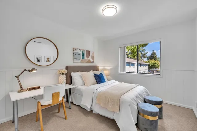 a bedroom with a bed and cabinets