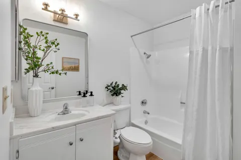a utility room with sink dryer and washer