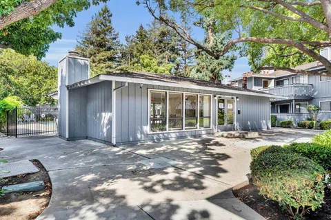 a front view of a house with a yard outdoor seating and yard