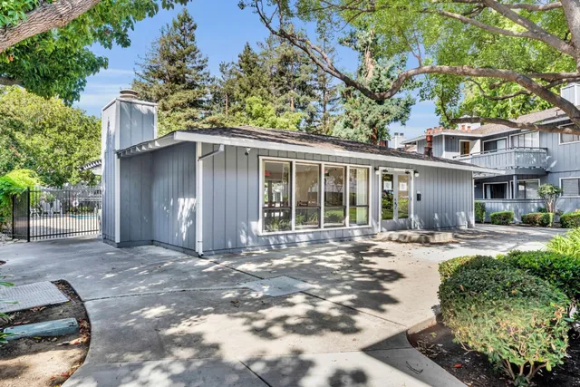 a front view of a house with a yard outdoor seating and yard