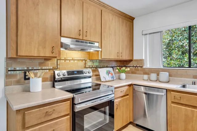 a kitchen with a sink and cabinets