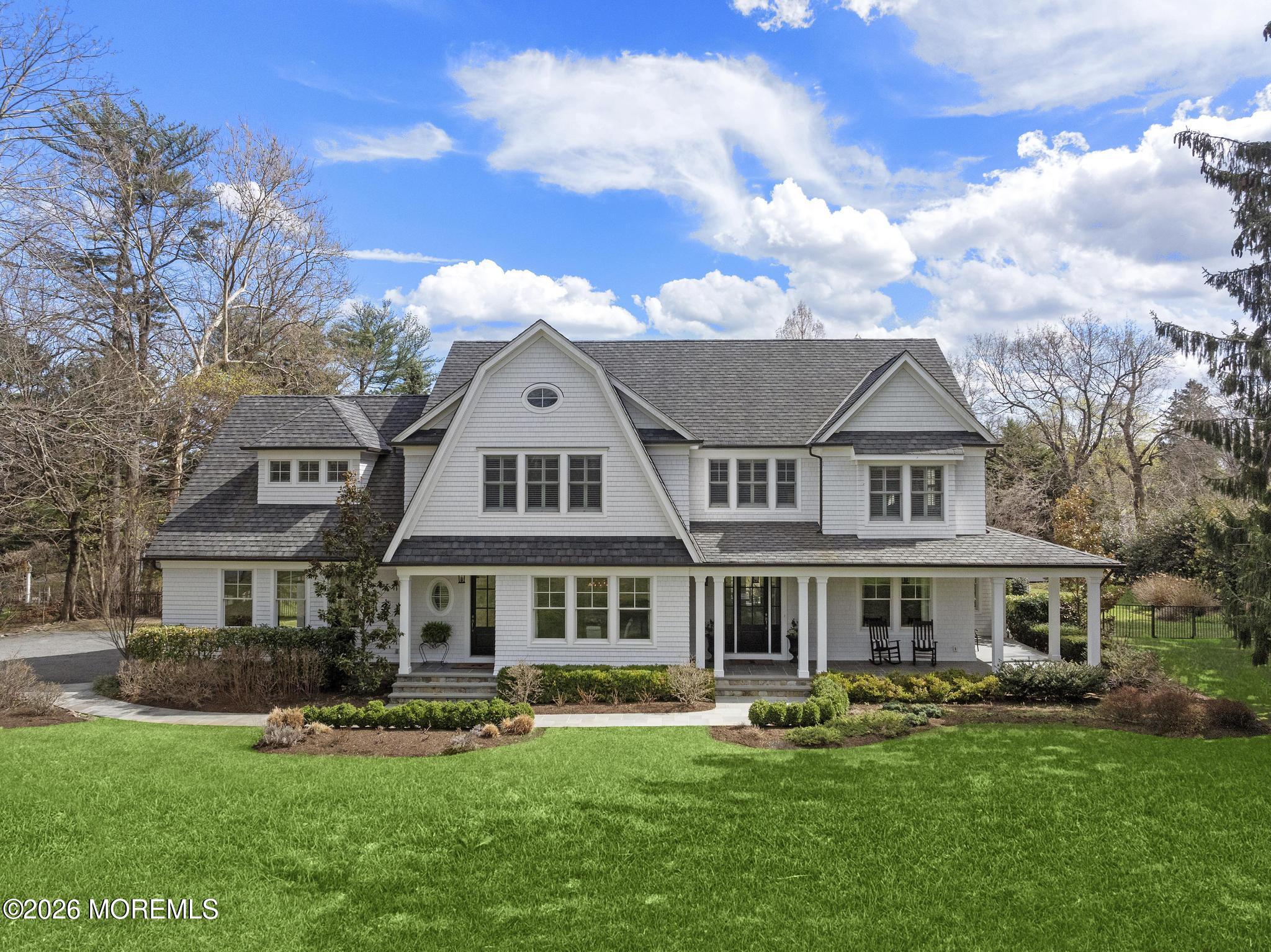 135 Ridge Road Rumson, NJ 07760 - Photo 1 of 49 front with photoshopped grass