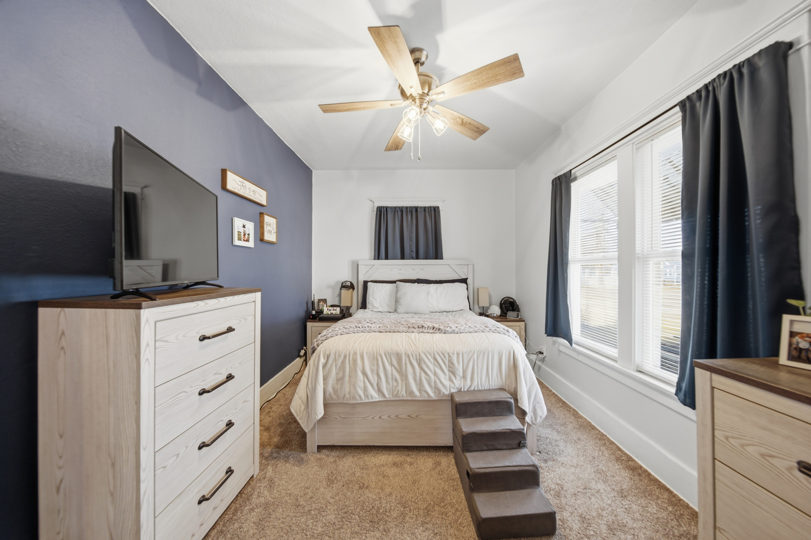 624 Palmyra Street Dixon, IL 61021 - Photo 20 of 29 a bedroom with a large bed and a flat tv screen on dresser