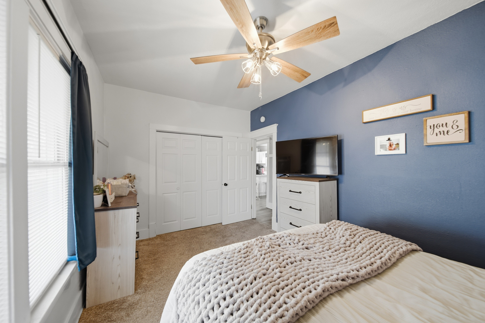624 Palmyra Street Dixon, IL 61021 - Photo 21 of 29 a bedroom with a bed and a flat screen tv