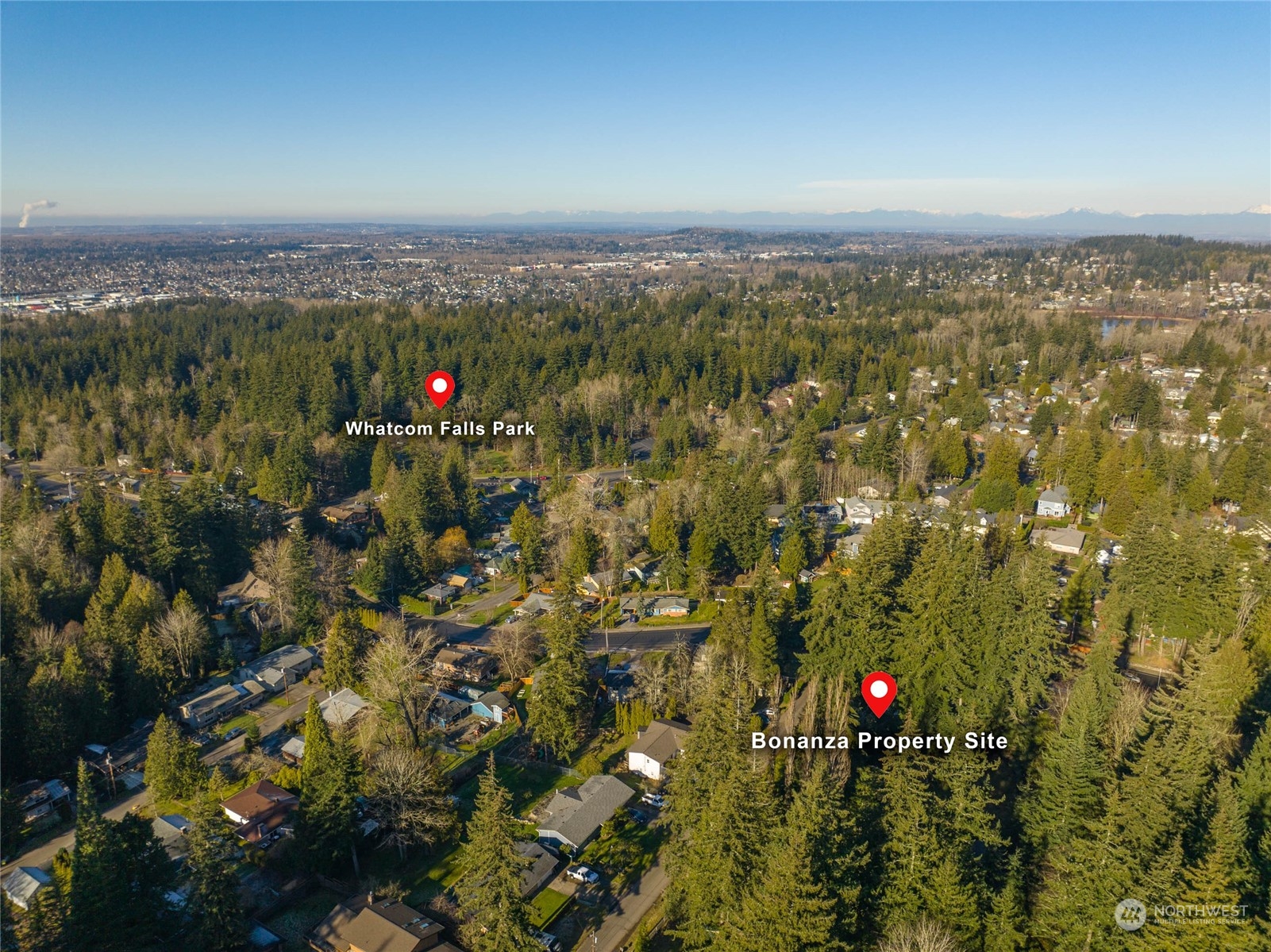 0 Bonanza Way Bellingham, WA 98229 - Photo 2 of 14 an aerial view of residential building with green space and mountain view in back